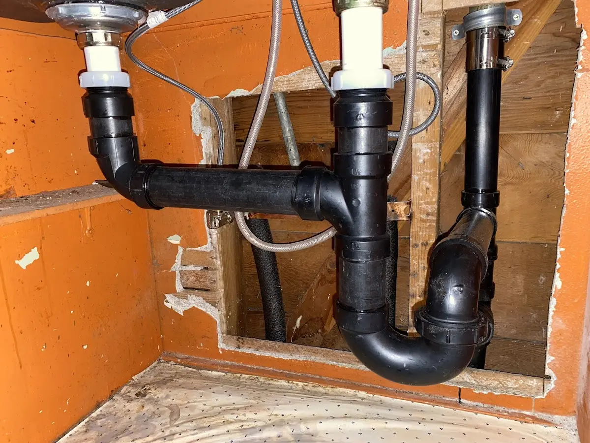 Professional Garbage Disposal Repair equipment and tools on the job in Wrightstown